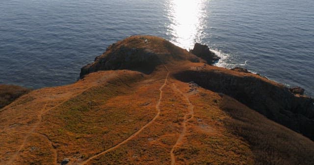 Serene Coastal Landscape with Hills and Sea