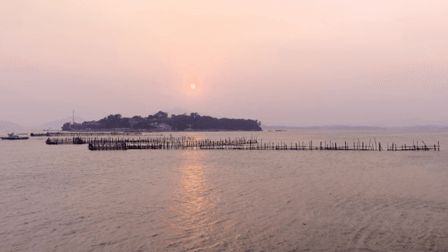 Sunset over a serene coastal landscape