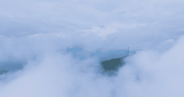 Mountain summit surrounded by clouds
