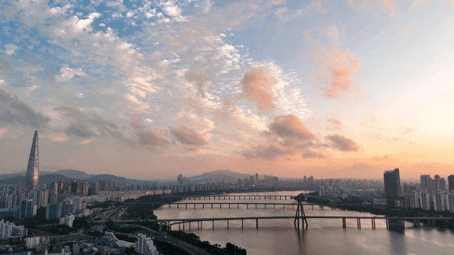City skyline with river at sunset