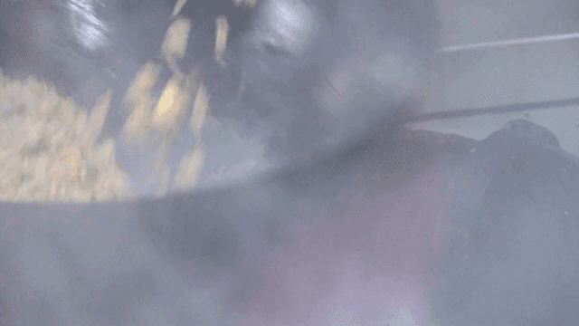 Stir-frying vegetables in a hot wok