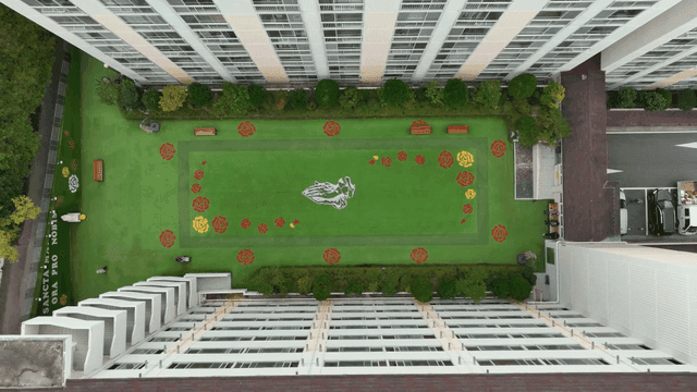 Aerial view of apartment complex with garden