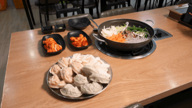 Ingredients for dumpling hot pot placed on table