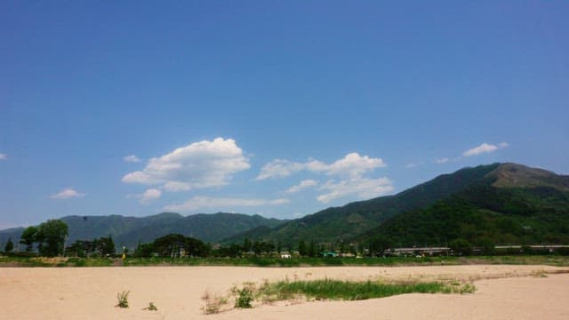 Majestic mountains and sandbed under a clear blue sky