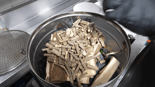 Medicinal herbs in broth strainer prepared in kitchen