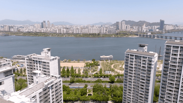 City skyline with river and park