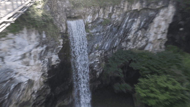Waterfall cascading down rocky cliffs