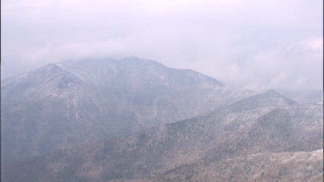 Misty Mountains Covered in Snow