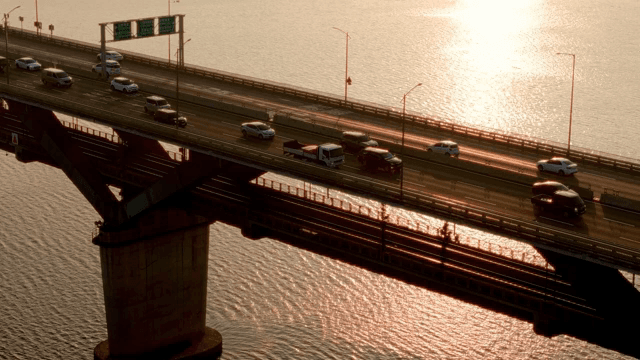 Bridge with vehicles during sunset