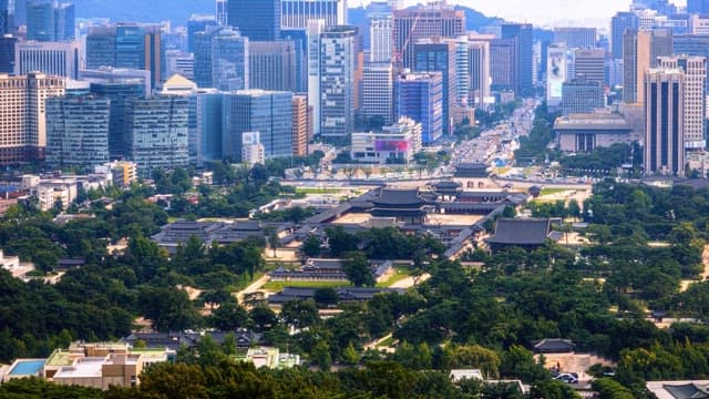 View of a city with modern skyscrapers and traditional buildings