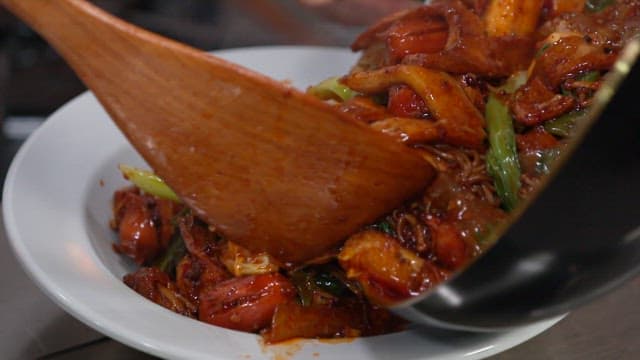 Hot and Spicy Stir-fried Vegetables Served on a White Plate