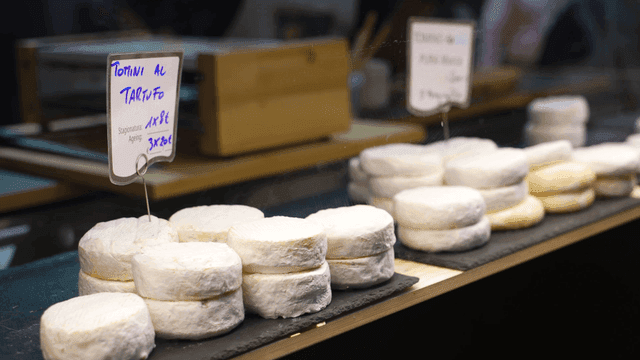 Various cheeses displayed on a counter