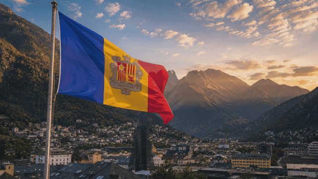 Andorran flag fluttering above mountains and villages