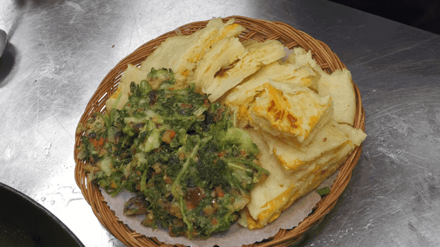Shiitake mushroom and coriander pancakes and cabbage pancakes in basket