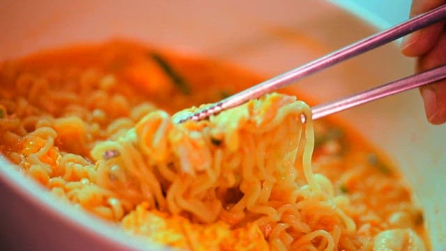 Ramyeon picked up with chopsticks