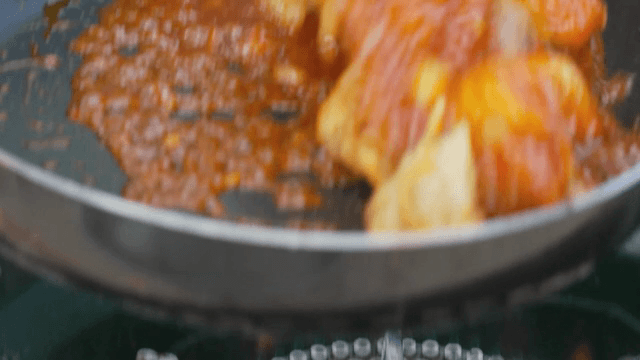 Frying eggplant in a pan with sauce