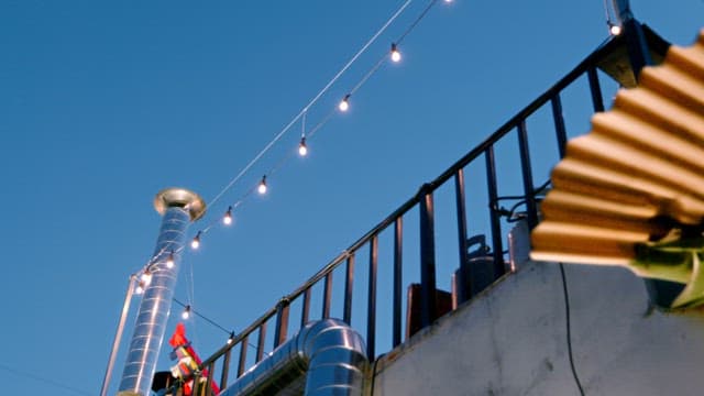 Rooftop with string lights and chimney