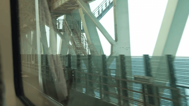 View from a train window crossing a bridge