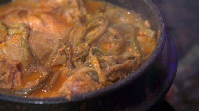 Duck soup boiling in an earthen pot