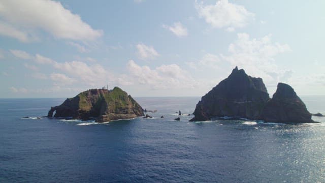 Scenic view of rocky islands in blue sea