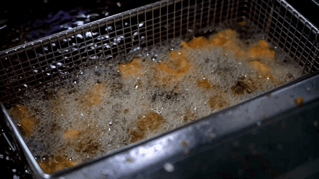 Chicken fried in hot oil