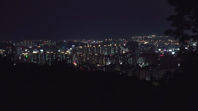 Night view of a bustling cityscape with bright lights