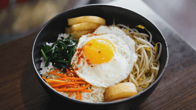Bibimbap with fried eggs and vegetables