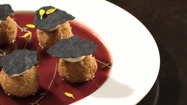 Croquettes topped with crispy truffle