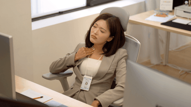 Tired-looking female office worker