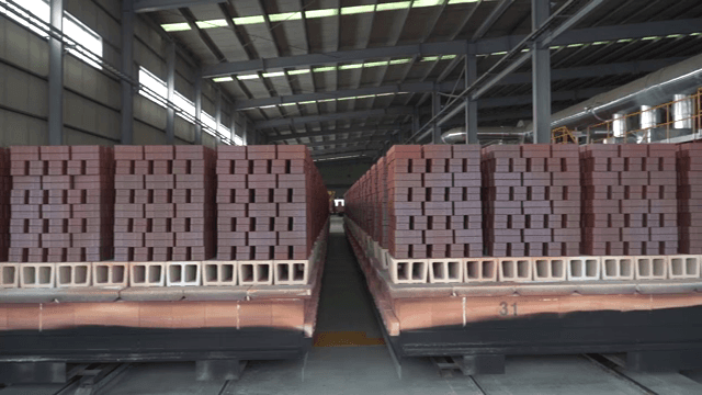 Stacks of bricks in a factory setting