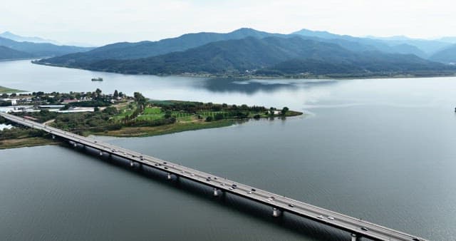 Scenic river with a bridge and mountains