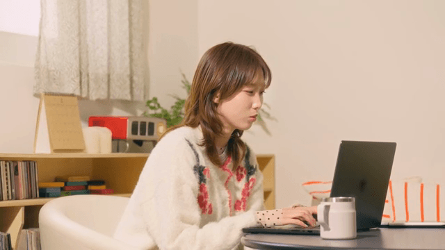 Woman working on a laptop indoors