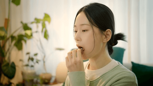 Woman takes medicine and drinks water