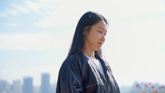 Woman listening to music outdoors