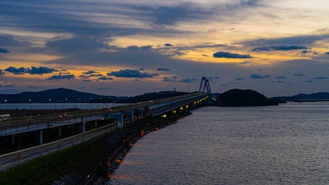Illuminated Coatal Bridge over the Sea at Dusk