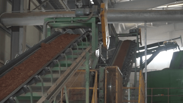 Conveyor belt transporting soil