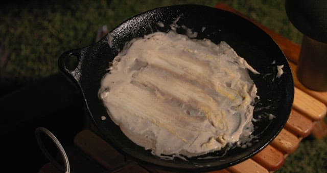 Preparing Vegetable Pancakes Outdoors at Night