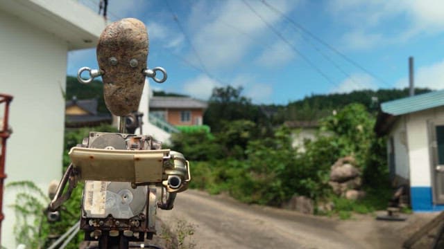 맑은 날 시골에서 무언가를 읽는 로봇