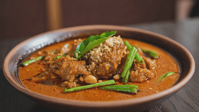 Bowl of spicy red curry with vegetables