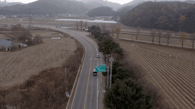 Country road crossing farmland