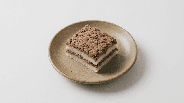 Piece of red bean steamed rice cake on plate
