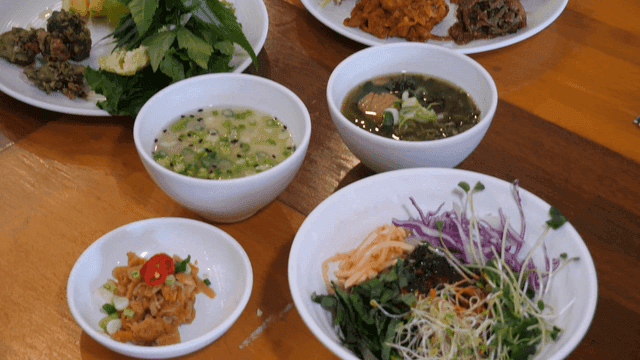 Plates containing various Korean dishes