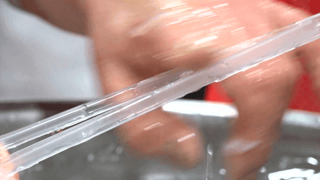 Strainer preparing ice fish in large basin