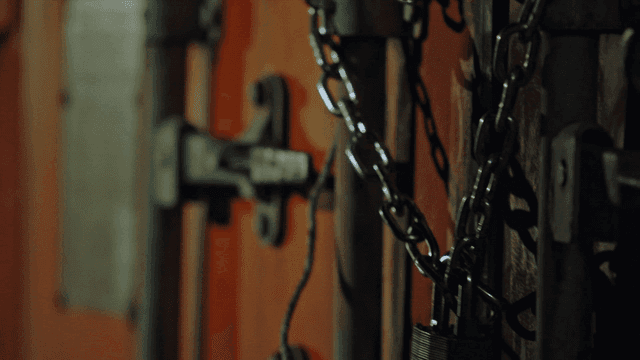 Chain and lock securing a container door