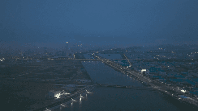 Night view of a city with riverside roads