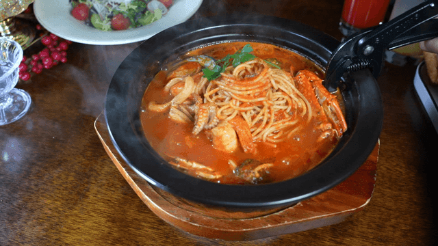 Seafood pasta in a steaming pot