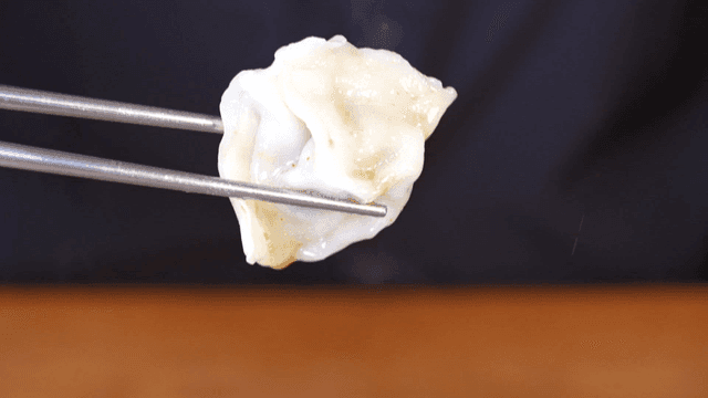 Steaming dumplings in a hot pot