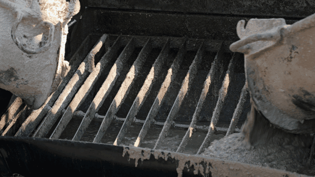 Concrete pouring into a mixer