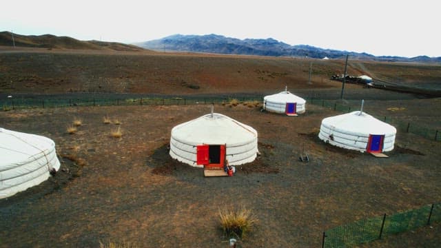 Nomadic Settlement Located Amidst Barren Grasslands.