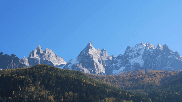 Snow-capped mountains under a clear blue sky